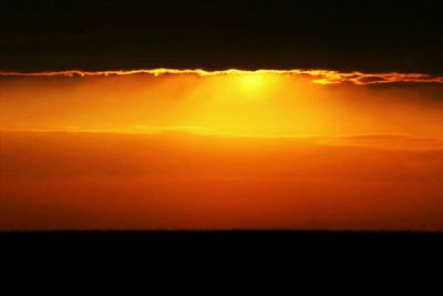 Scenic view of dramatic sky during sunset