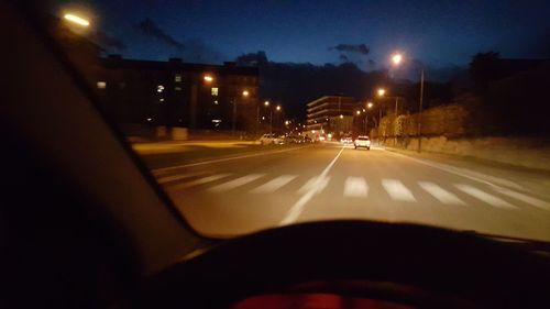 Illuminated road at night