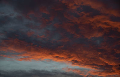 Low angle view of dramatic sky during sunset