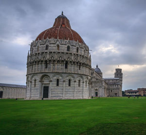 Low angle view of historic building against cloudy sky