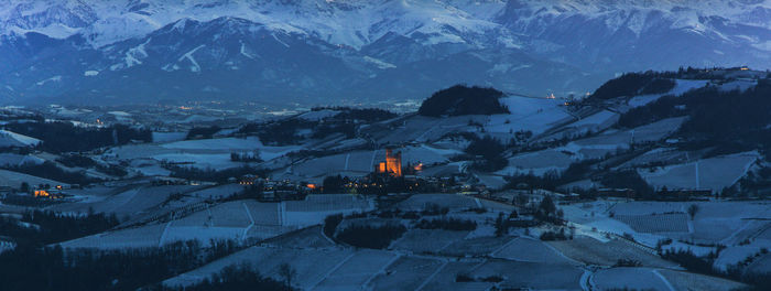 High angle view of snow covered mountains against sky