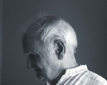 Close-up of man against gray background