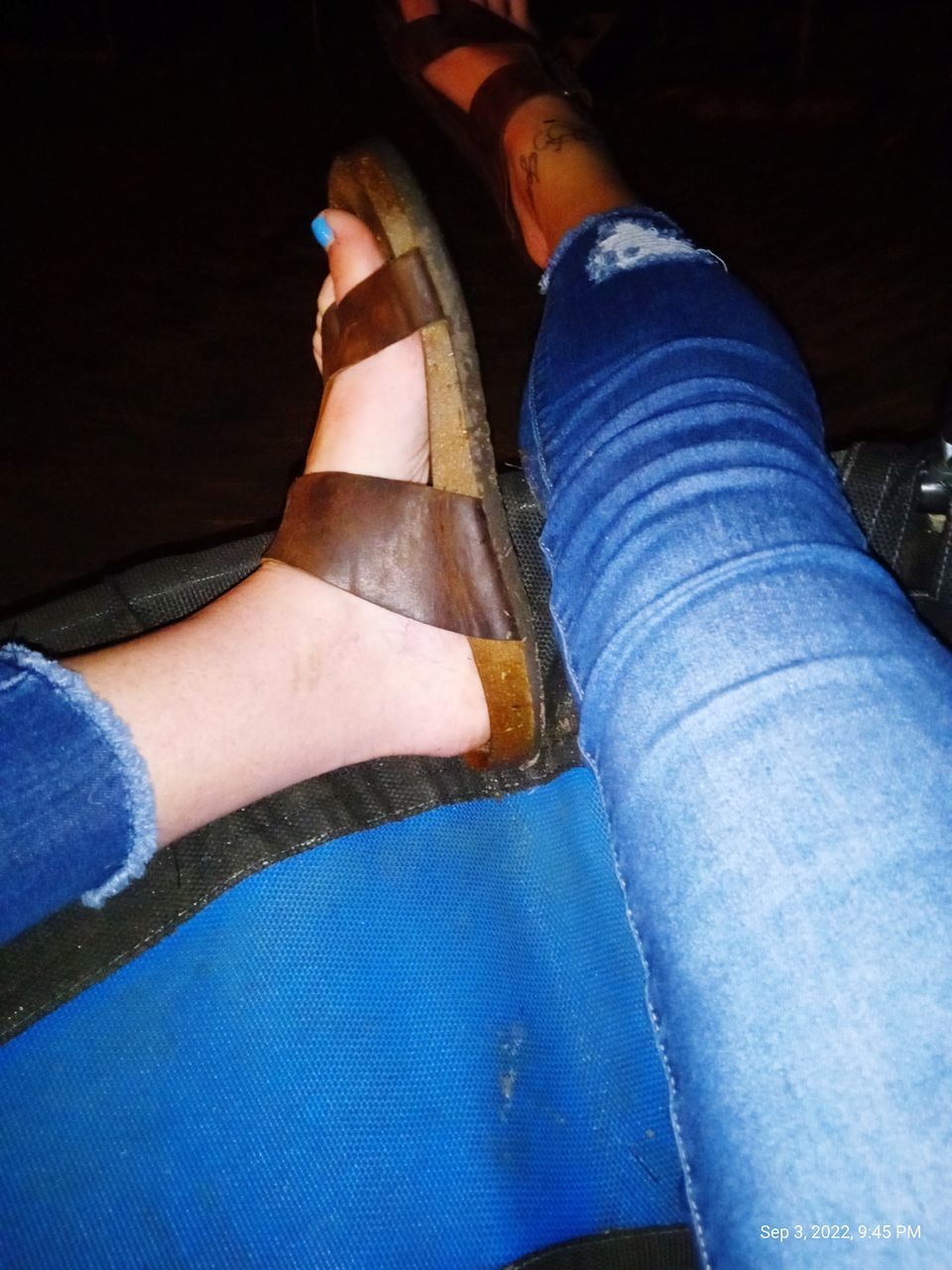 blue, human leg, footwear, low section, limb, jeans, adult, human limb, shoe, one person, arm, personal perspective, lifestyles, casual clothing, hand, women, human foot, denim, indoors, clothing, sitting, leisure activity, high angle view, men