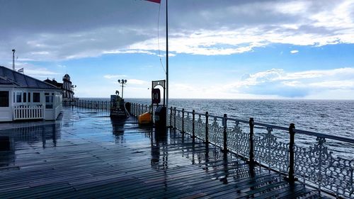 Pier over sea against sky