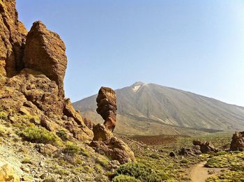 Scenic view of mountains against clear sky