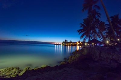 Scenic view of sea against sky at dusk