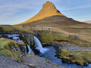 Kirkjufell and kirkjufellsfoss in sunset