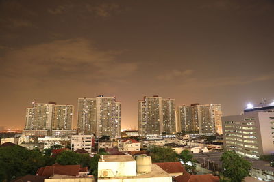 High angle view of illuminated buildings against sky