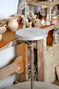 Pottery studio, empty potter's wheel, pottery from clay on the table