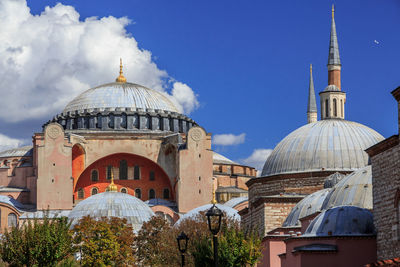 Panoramic view of mosque in city against sky