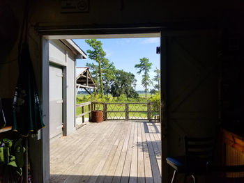 View of empty chairs and tables against window