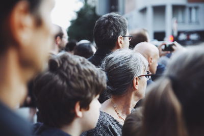 Rear view of people in city