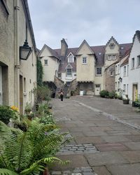Street amidst buildings against sky