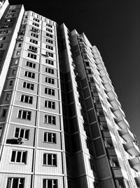 Low angle view of modern buildings against sky at night