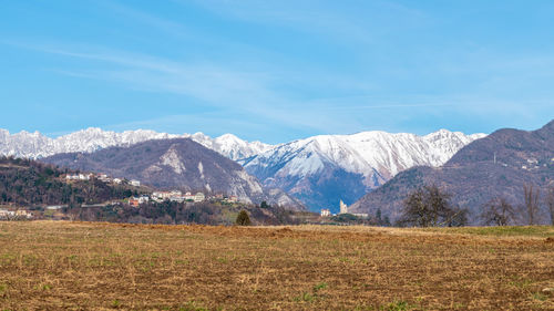 Scenic view of snowcapped mountains against sky