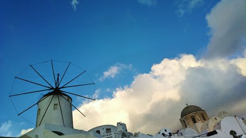 Low angle view of traditional building against blue sky