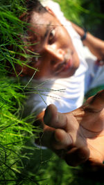 Midsection of woman holding plant