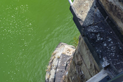 High angle view of wall by sea