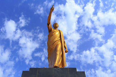 Low angle view of statue against sky