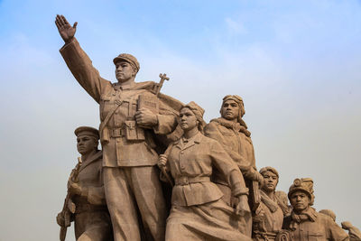 Low angle view of statue against sky