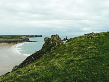 Scenic view of coastline against sky