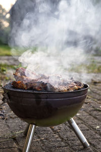 Close-up of meat on barbecue grill