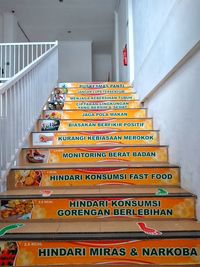 Low angle view of text on staircase in building