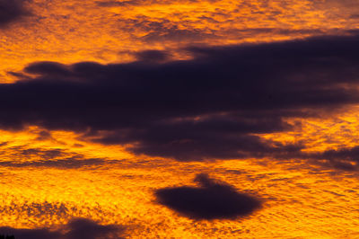 Low angle view of orange cloudy sky