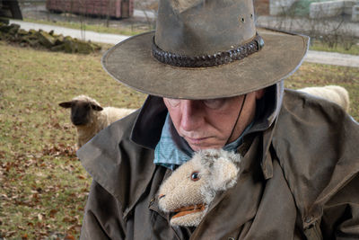 Close-up of man with toy in jacket