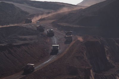 Huge trucks carry ore in day mining company in africa
