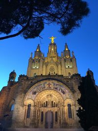 Low angle view of cathedral against blue sky