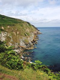 Scenic view of sea against cloudy sky