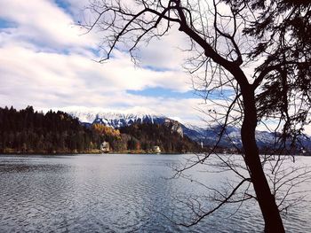 Scenic view of mountains and lake against sky during winter