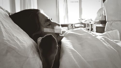 Senior patient rests in hospital bed