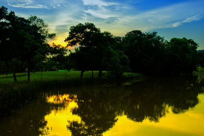 Scenic view of lake against sky during sunset
