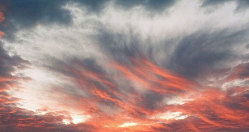 Low angle view of dramatic sky during sunset