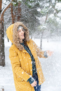 Portrait of a young woman in snow