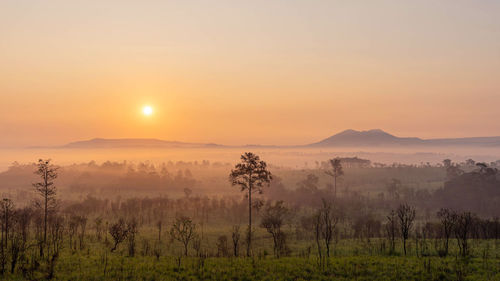 Scenic view of landscape against sky during sunset