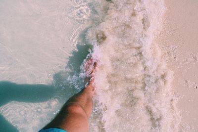 Low section of man on beach