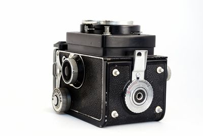 Close-up of camera against white background
