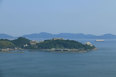 Scenic view of bay against clear sky