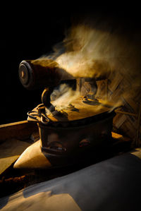 Close-up of person preparing food on wooden table