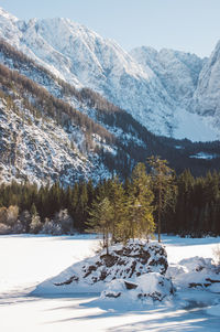 Snow coverd lake and mountains, laghi di fusine in winter