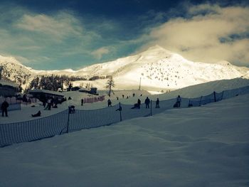 Scenic view of snow covered mountains against sky