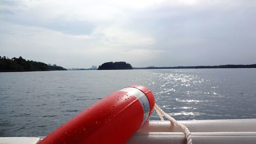 Close-up of rope on sea against sky