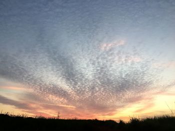 Scenic view of dramatic sky during sunset