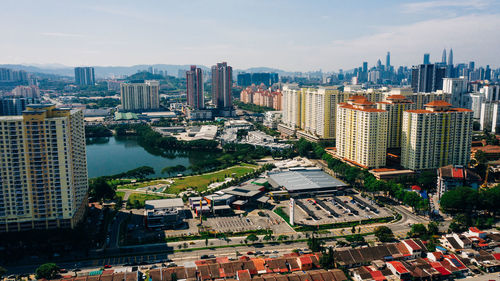 High angle view of buildings in city against sky