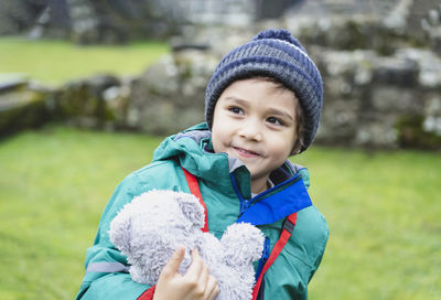 Smiling boy in park during winter