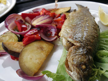 Fried fresh from lake trout fish and potatoes food in austria 