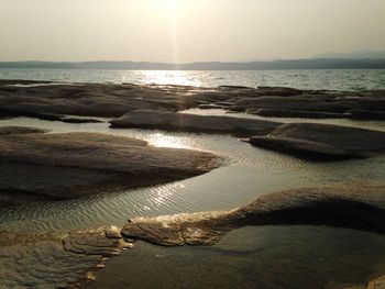 Scenic view of sea against sky at sunset